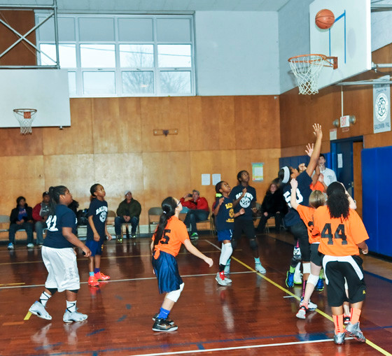 Girls in the seventh and eighth-grade division contended for a rebound.