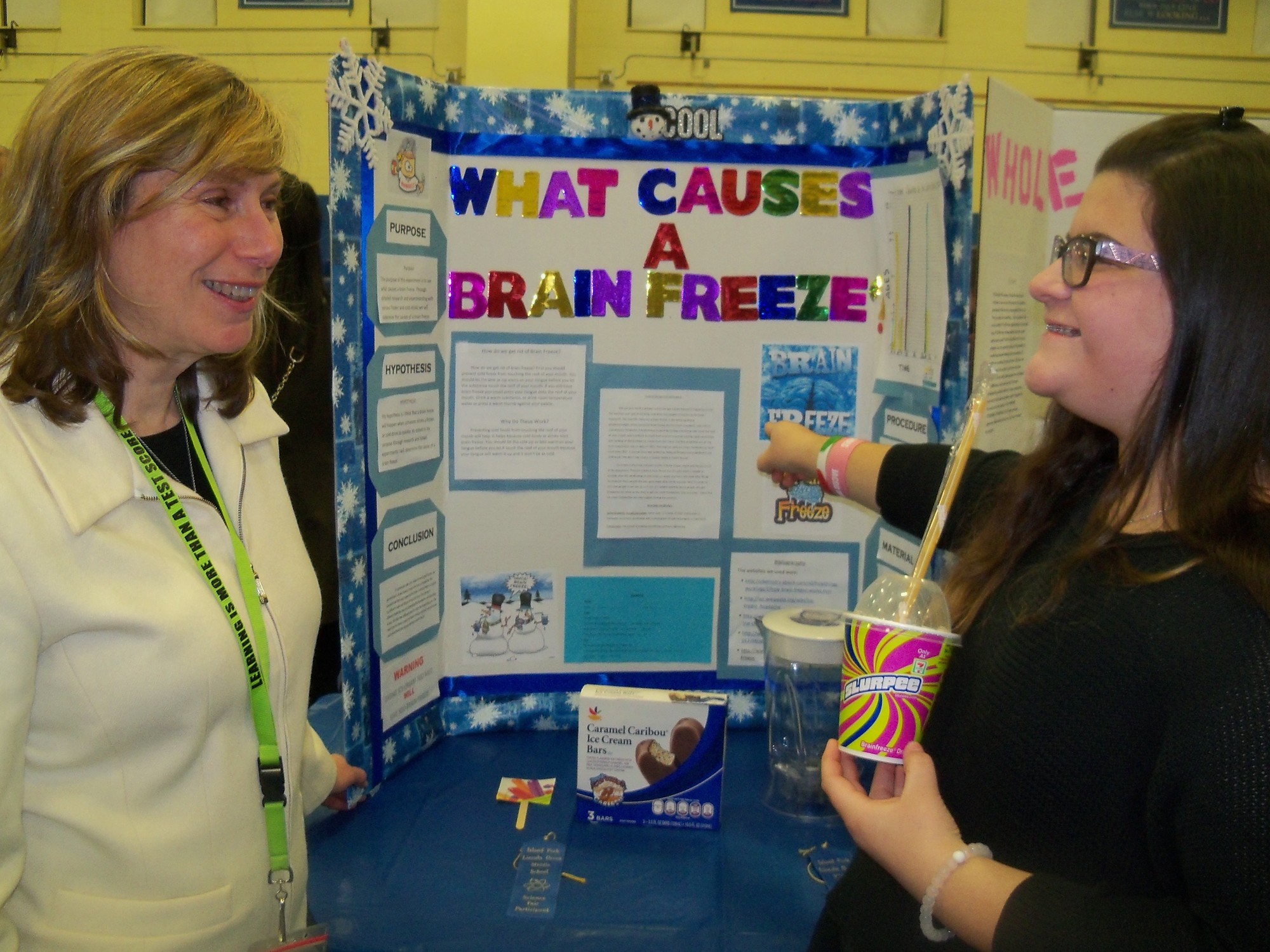 Jenna DeBellis learned the cause of “Brain Freeze” and answered questions about her methodology from Science Teacher Sheryl Waxberg.
