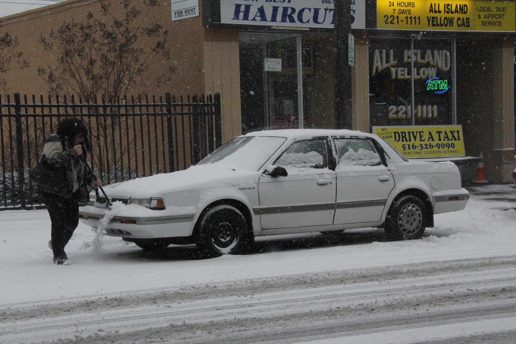 A motorist clears her car in Wantagh.