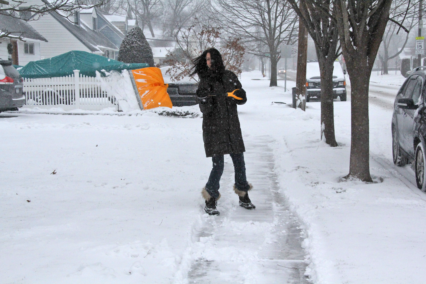 Sharleen Bussani cleared the sidewalk in front of her Jackson Avenue home in Seaford.