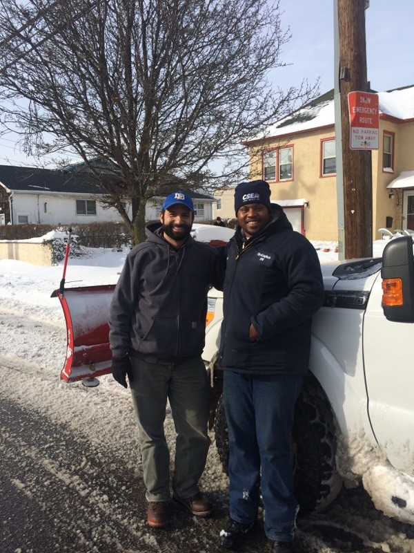 City Council President Anthony Eramo, left, with Deandre Butler, who works for the city's Beach Maintenance Department and was among the DPW crews who worked throughout the night clearing local streets.