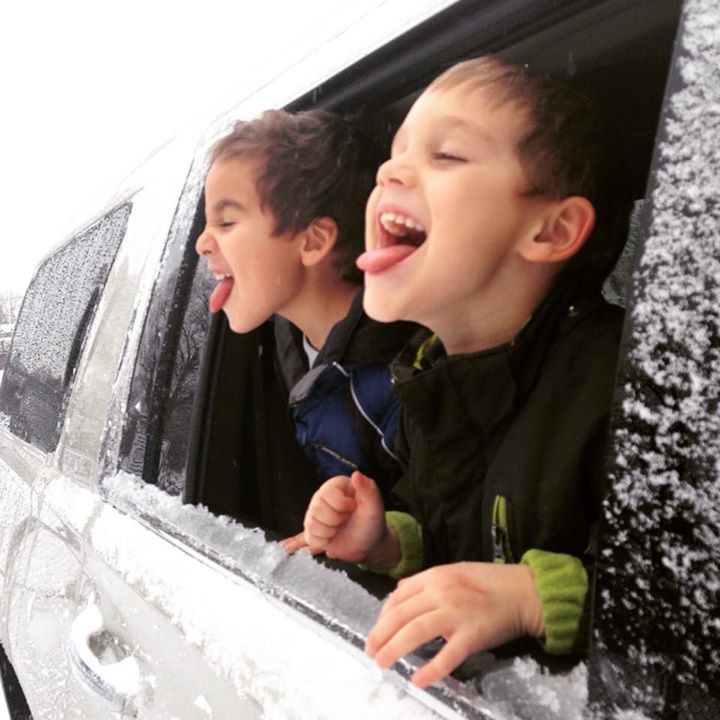 Dominic Caputo, right, and Sebastian Ricottone, of Island Park, enjoyed the feeling of flakes on their tongues.