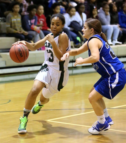 Elmont's Arielle Pierre, left, drove against Long Beach's Jaclyn Marry during last Friday's Conference AA-III game won by the Lady Spartans, 80-62.