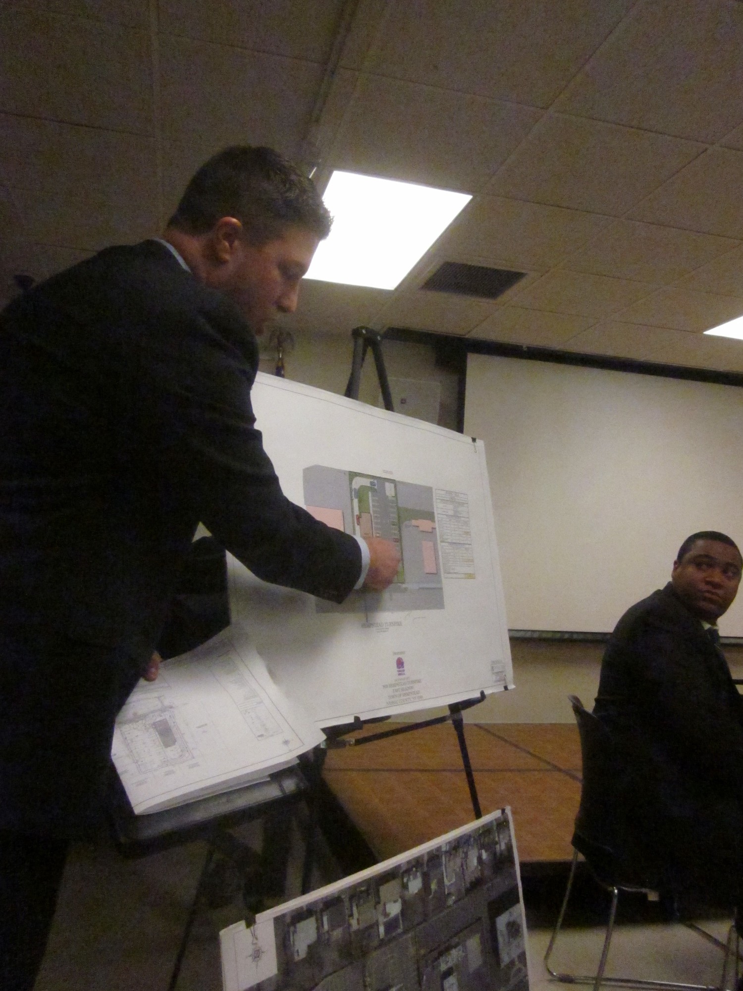 Eric Meyn, left, and Jared Jones, of Bohler Engineering, explained the site plan at the Jan. 22 community forum.