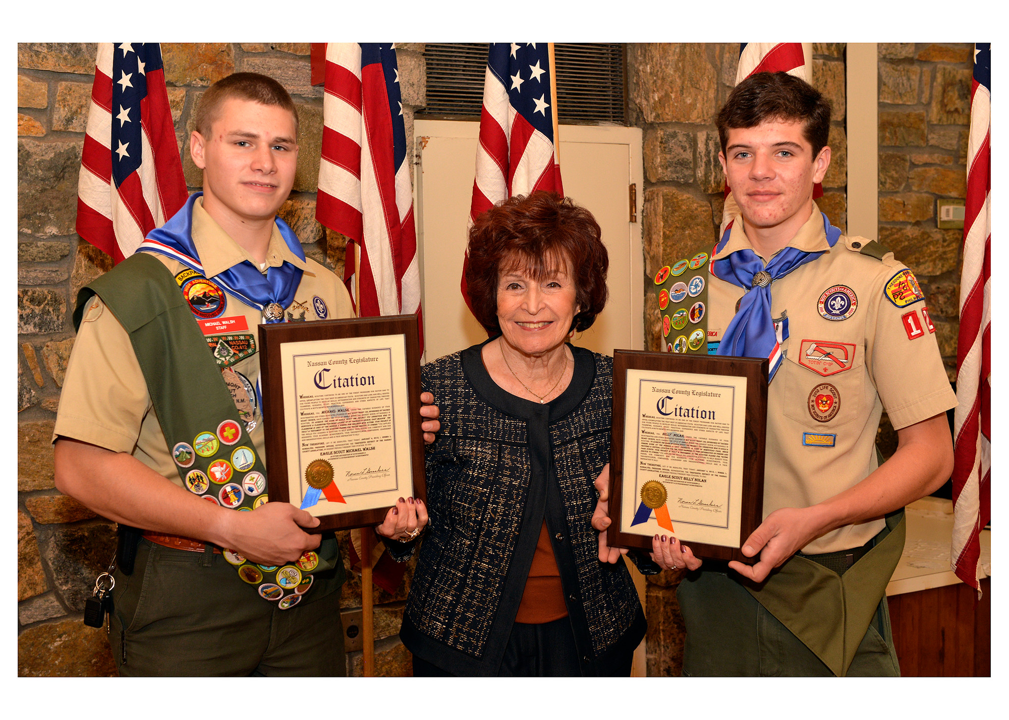 East Meadow Eagle Scout Michael Walsh, left, and Billy Nolan, both of Troop 123, were congratulated by Nassau County Legislature Presiding Officer Norma Gonsalves for their community service.