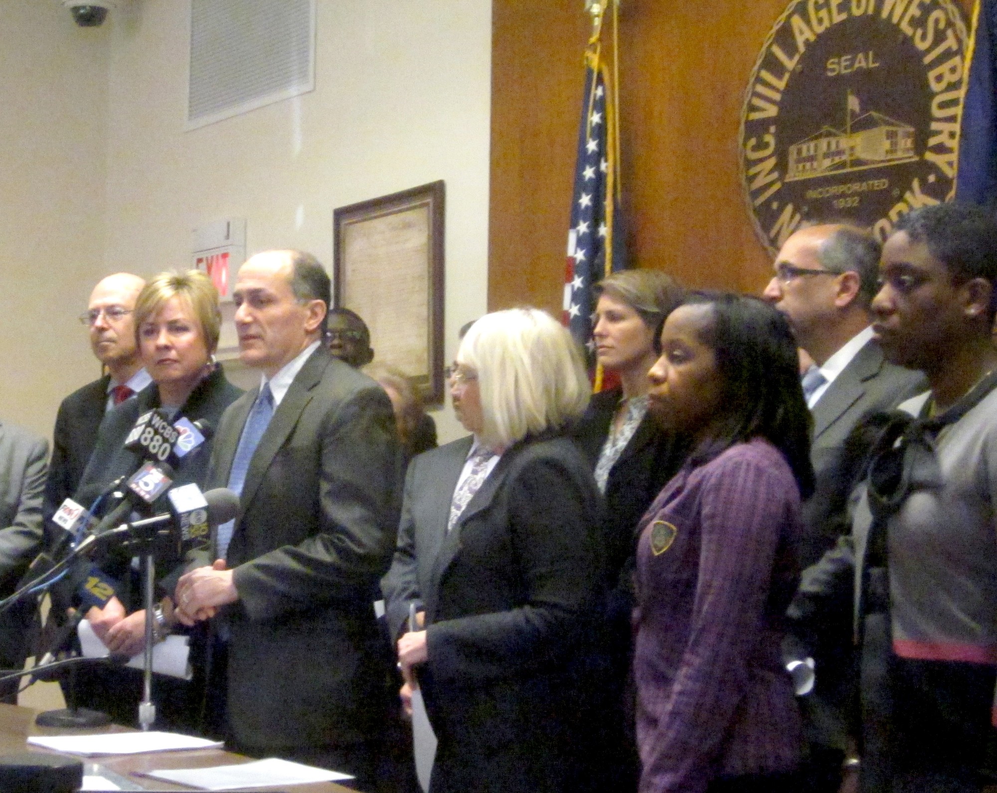 Westbury Mayor Peter Cavallaro, joined to his right by Town of Hempstead Supervisor Kate Murray, and to his left by Town of North Hempstead Supervisor Judi Bosworth, Councilwoman Viviana Russell and Nassau County Legislator Siela Bynoe in Westbury Village Hall on Thursday, announced their intention to file a lawsuit against Nassau Off Track Betting in Nassau County Supreme Court.