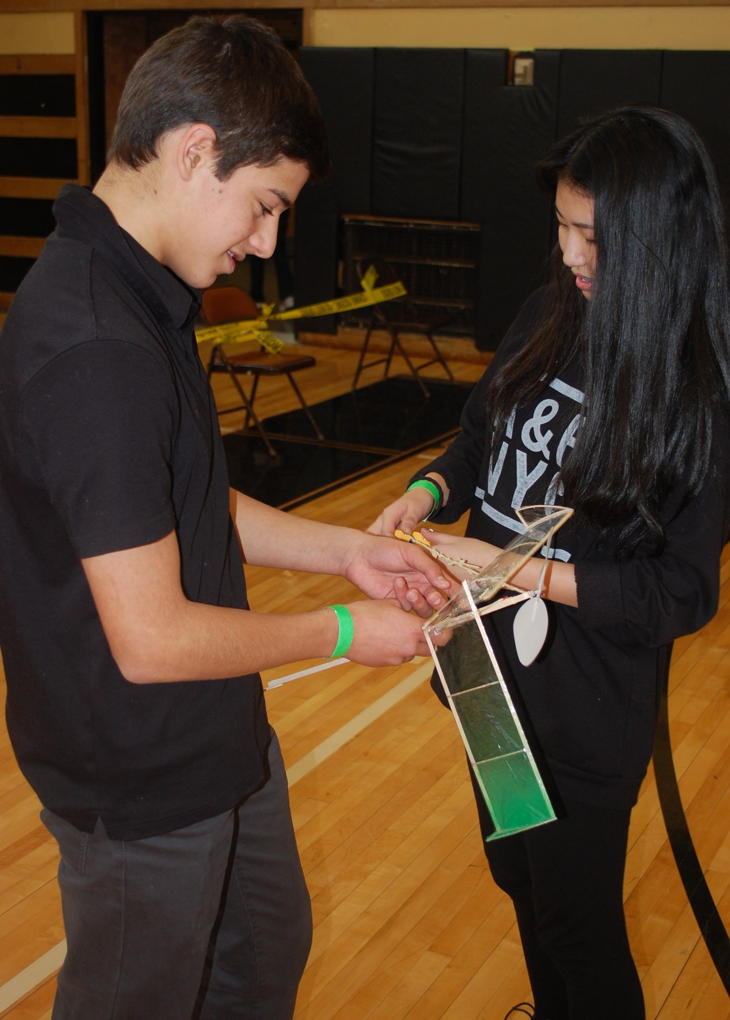 Steven Glatter and Ashley Kim of MacArthur High School made a repair to their airplane in the “Wright Stuff” event.
