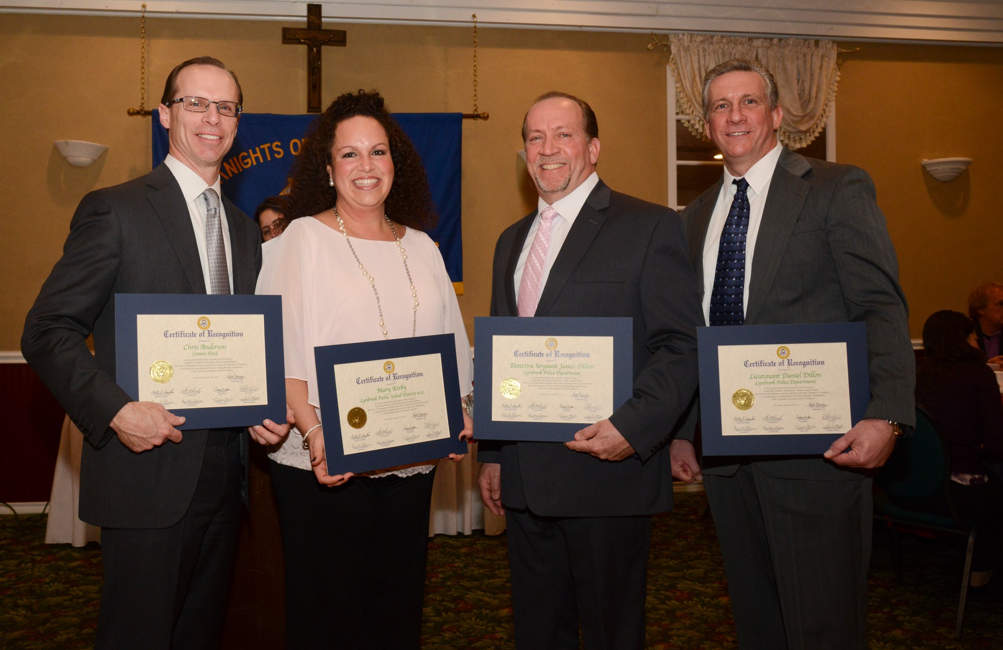 The honorees proudly dispalyed their awards. From left were Chris Anderson, Mary Kirby, James Dillon and Daniel Dillon.