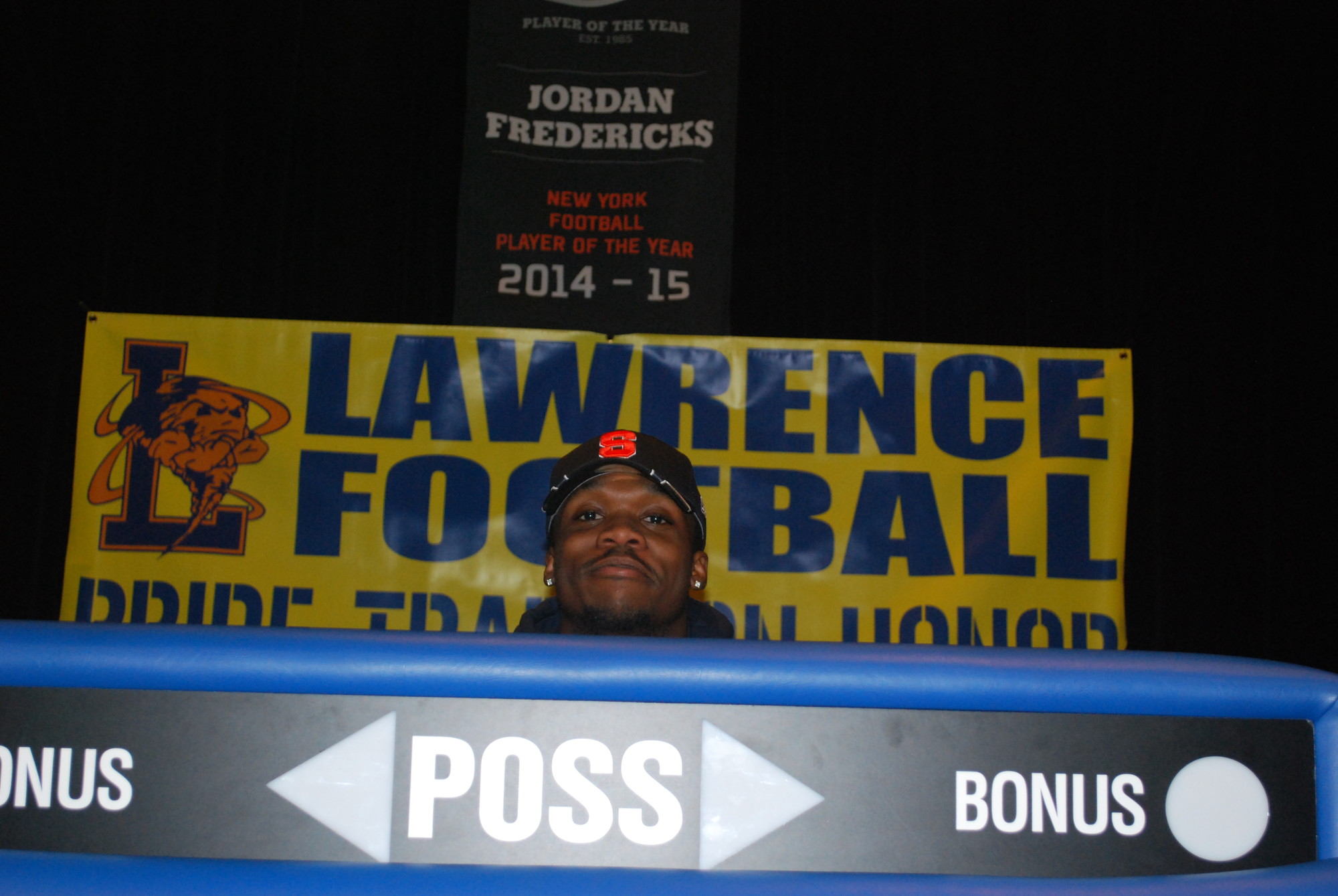 Syracuse University-bound football player Jordan Fredericks enjoyed his letter in intent signing event in Lawrence High's Little Theater.