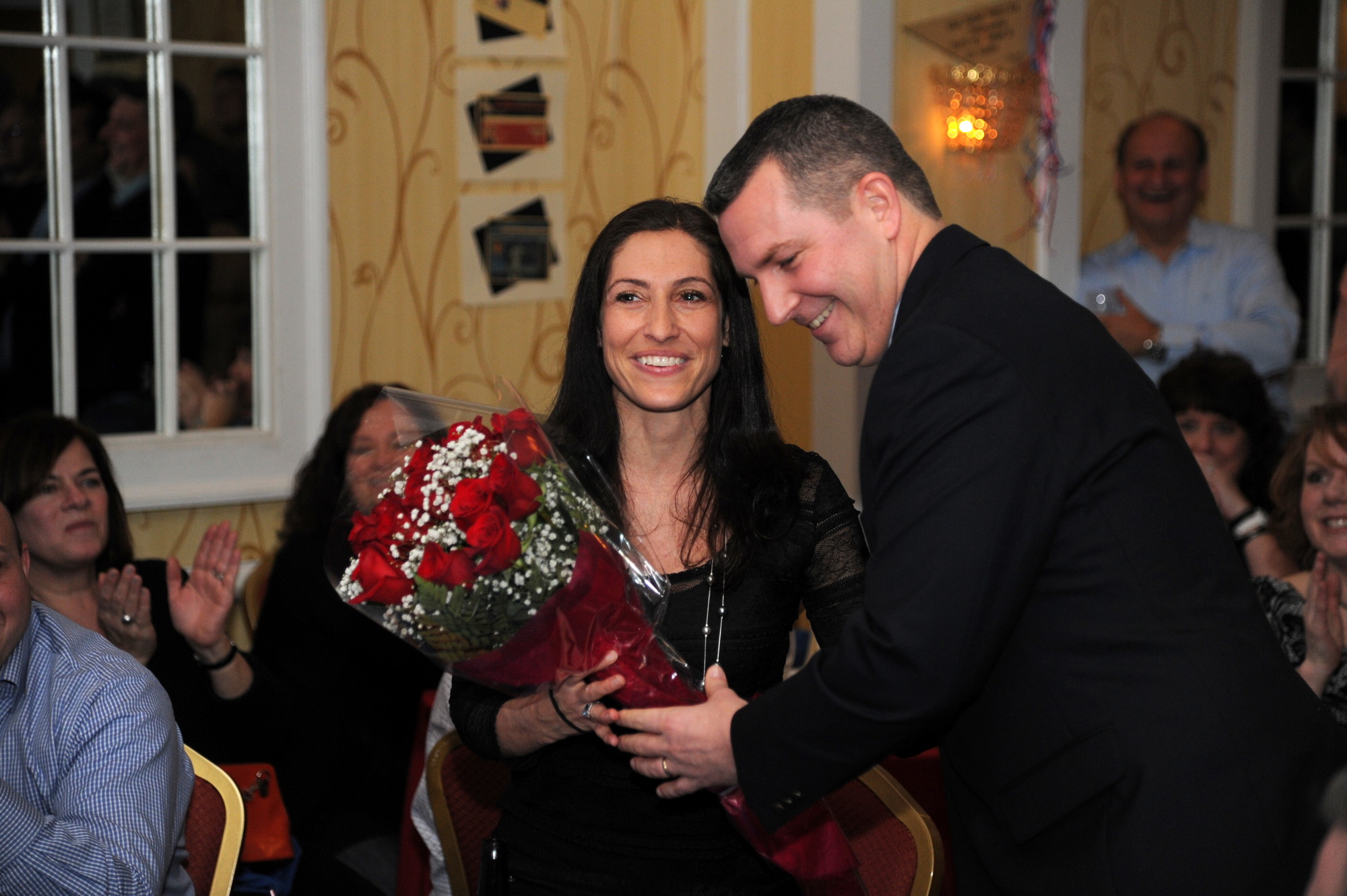 Coach Greg Brennan, one of the evening’s honorees, made sure to recognize his wife, Tara, with a bouquet of roses.