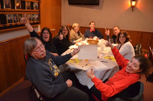 Captain Bill Wilson brandished his team’s name, “Saturday in the Park,” as they tried their hand at musical trivia hosted by the East Meadow Kiwanis Club.