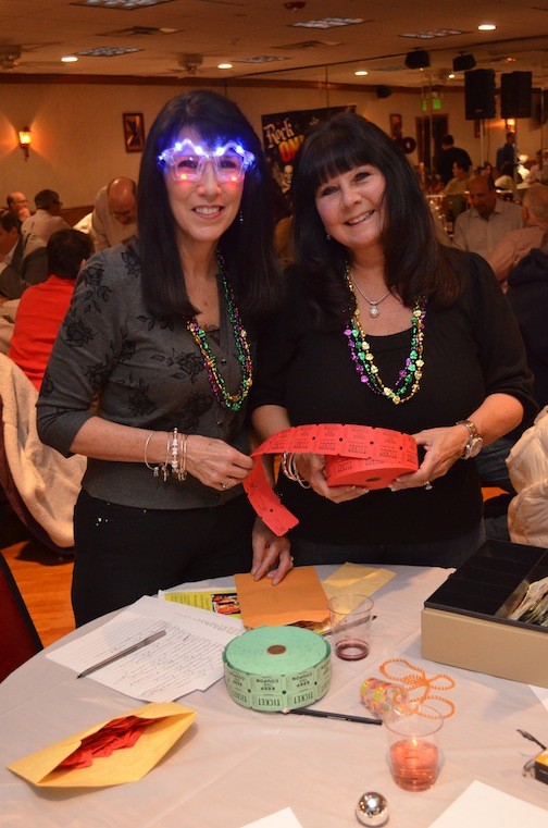 Debbie Coates, in fluorescent shades, and Debbie Kirsh, of the Kiwanis Club.
