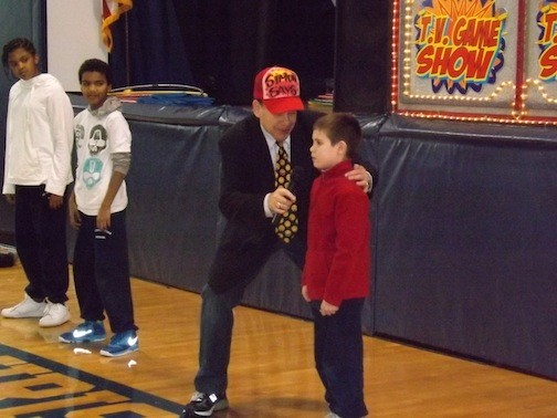 Jonathon Stasi-Welsh represented the Red Team in an intense game of Simon Says last week at St. Christopher School during National Catholic Schools week. Allen Strauss, of Hollyrock Entertainment, played Simon and looked to make the students slip up.