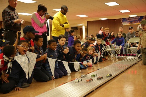 Members of Cub Scout Pack 824 looked on with bated breath during their annual Pinewood Derby at St. Christophers Church last month.