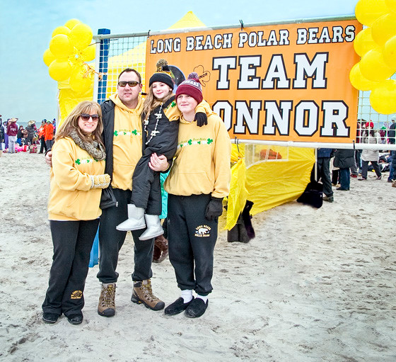 The family of Long Beach resident Connor Troy, who was granted a wish in 2012, still takes the plunge in his honor. From left were his parents, Kerry Ann, and Chris, sister, Katie, 6, and brother, Ryan, 15, who raised almost $6,000 for the Long Beach Polar Bears and Make-A-Wish Sunday as Team Connor.