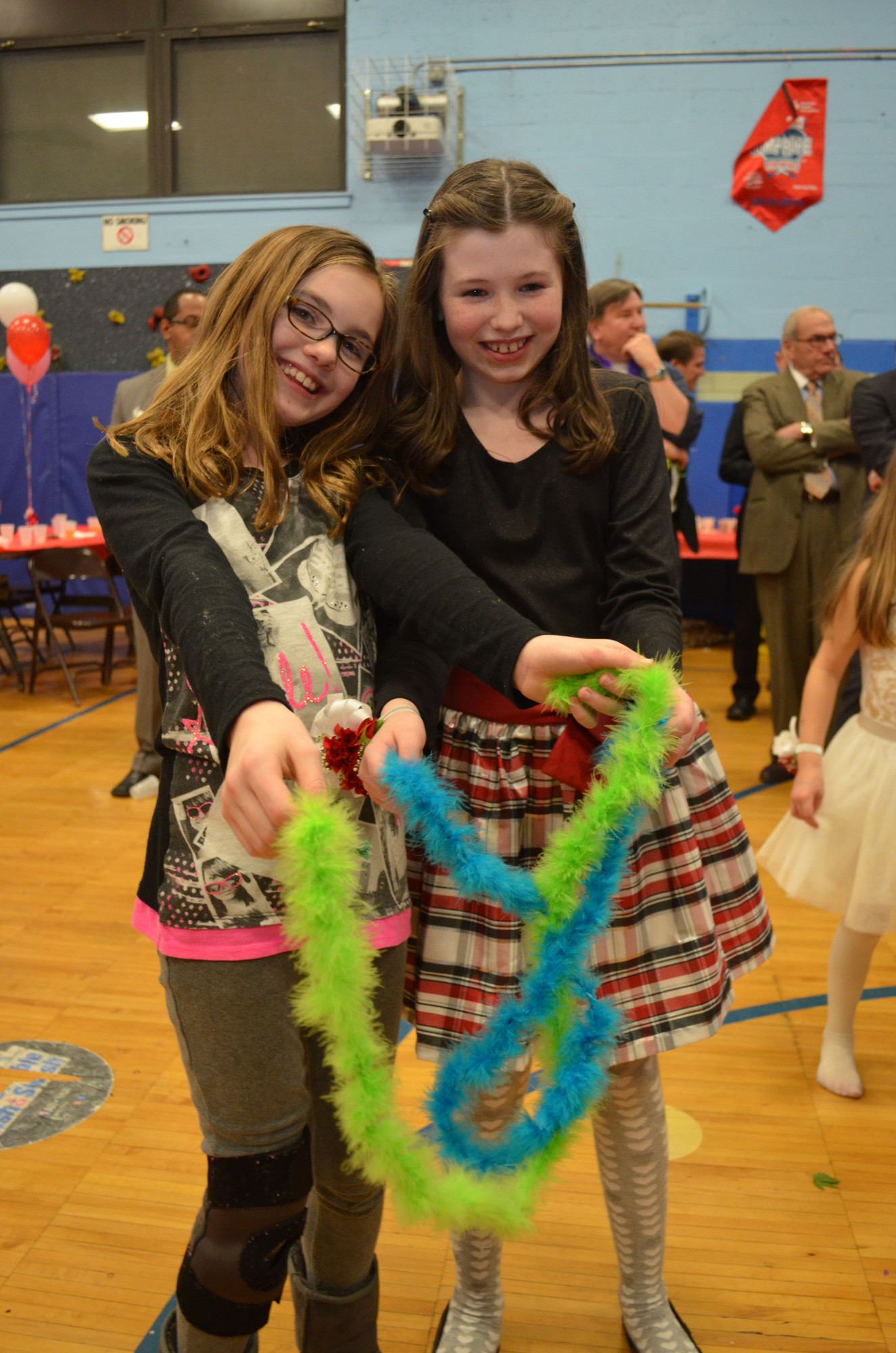 Fourth graders Reese Gallagher, left, and Sile Kelly hung out together at the dance.