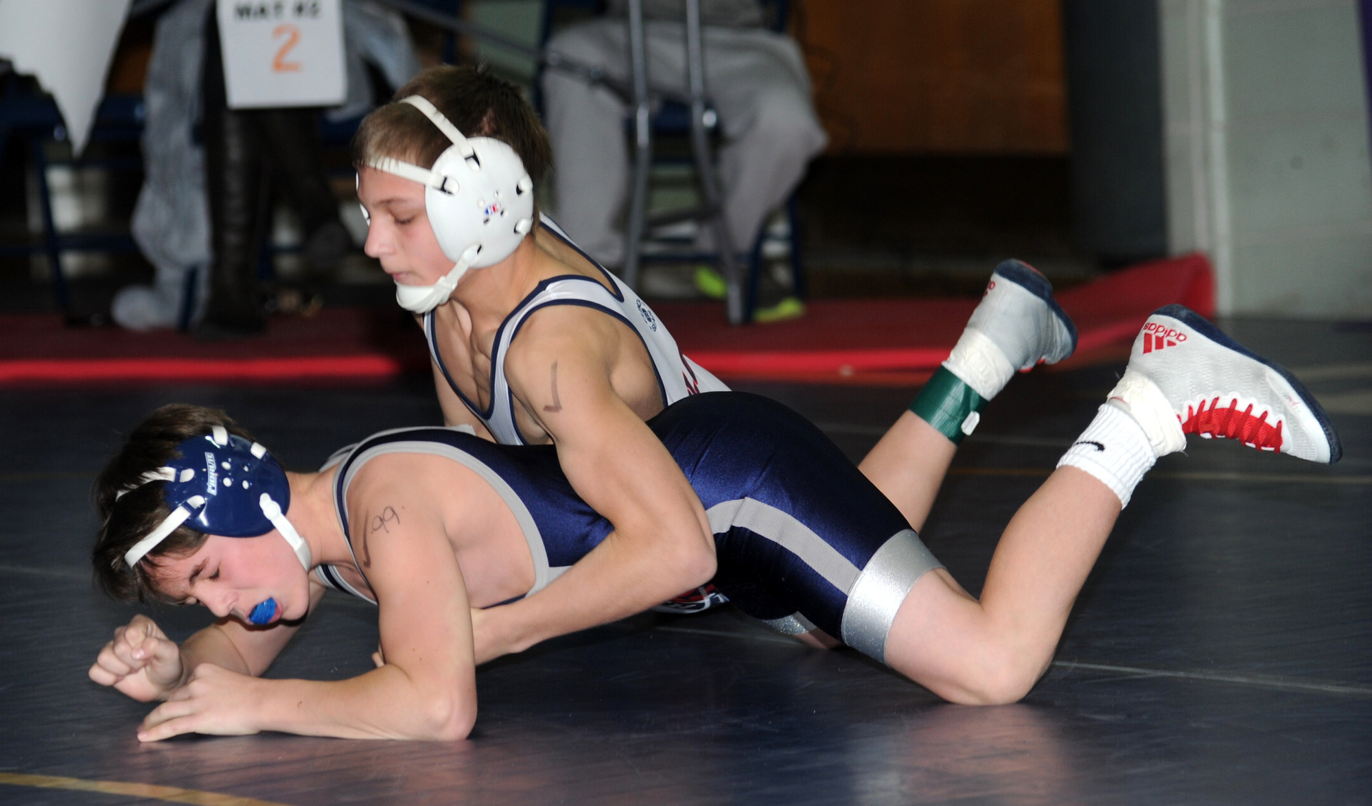 South Side’s Kyle Mosher, top, beat Hewlett’s Robbie Levitz on the way to winning the 99-pound title at the Nassau qualifier tournament hosted by Hewlett last Saturday.