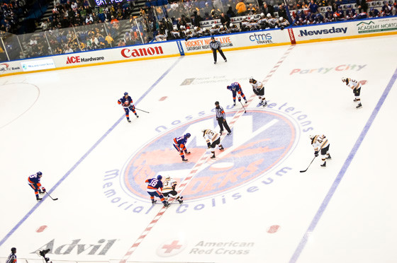 The Islanders and Boston Bruins lined up for a face-off at center ice during the Jan. 29 game at the Nassau Veterans Memorial Coliseum, the 79th time the two teams have met there.