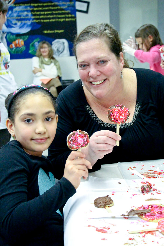 Natalia Houton, 8, decorated some delicious cookies with her mom Ellen Higgins.