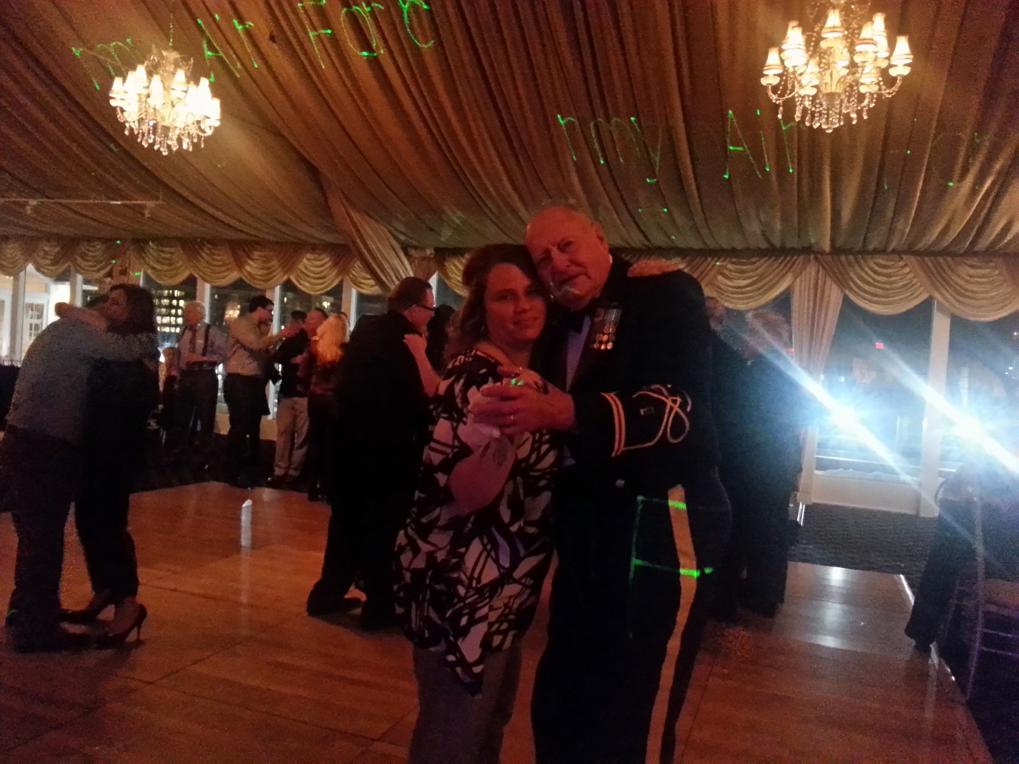 Caryn Deik dances with Retired Chief Warrant Officer Daniel Steele.