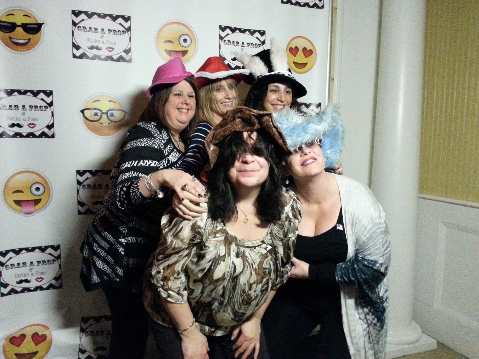 Dorothy McNely, Sue Bernabeo, Elaine Siermala Debra Konstantakis and Kathy Collins frolic in the photo booth.