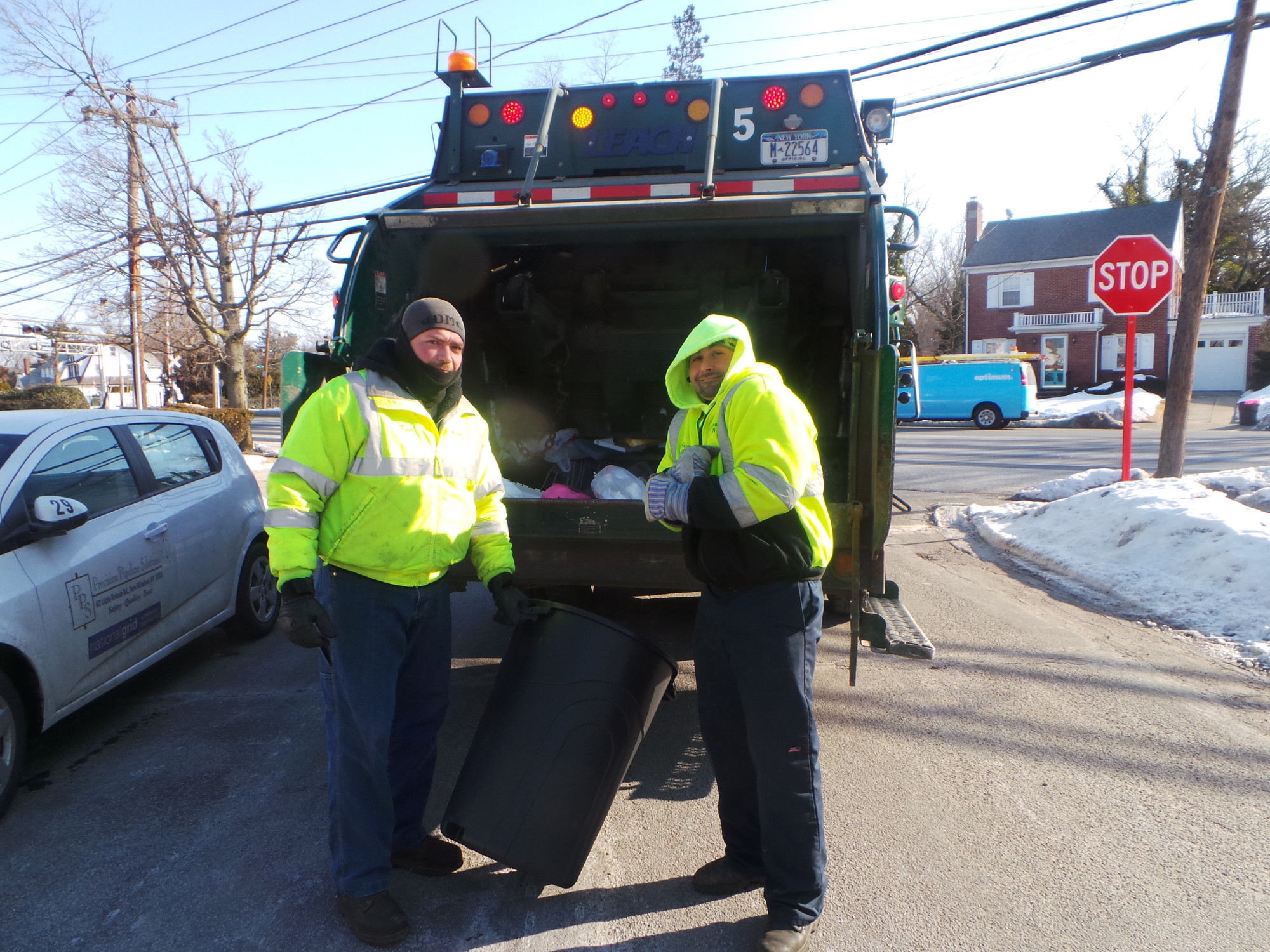 These two guys from the Department of Public Works were so cold they didn’t stop to give us their names, but they did continue to pick up the trash.