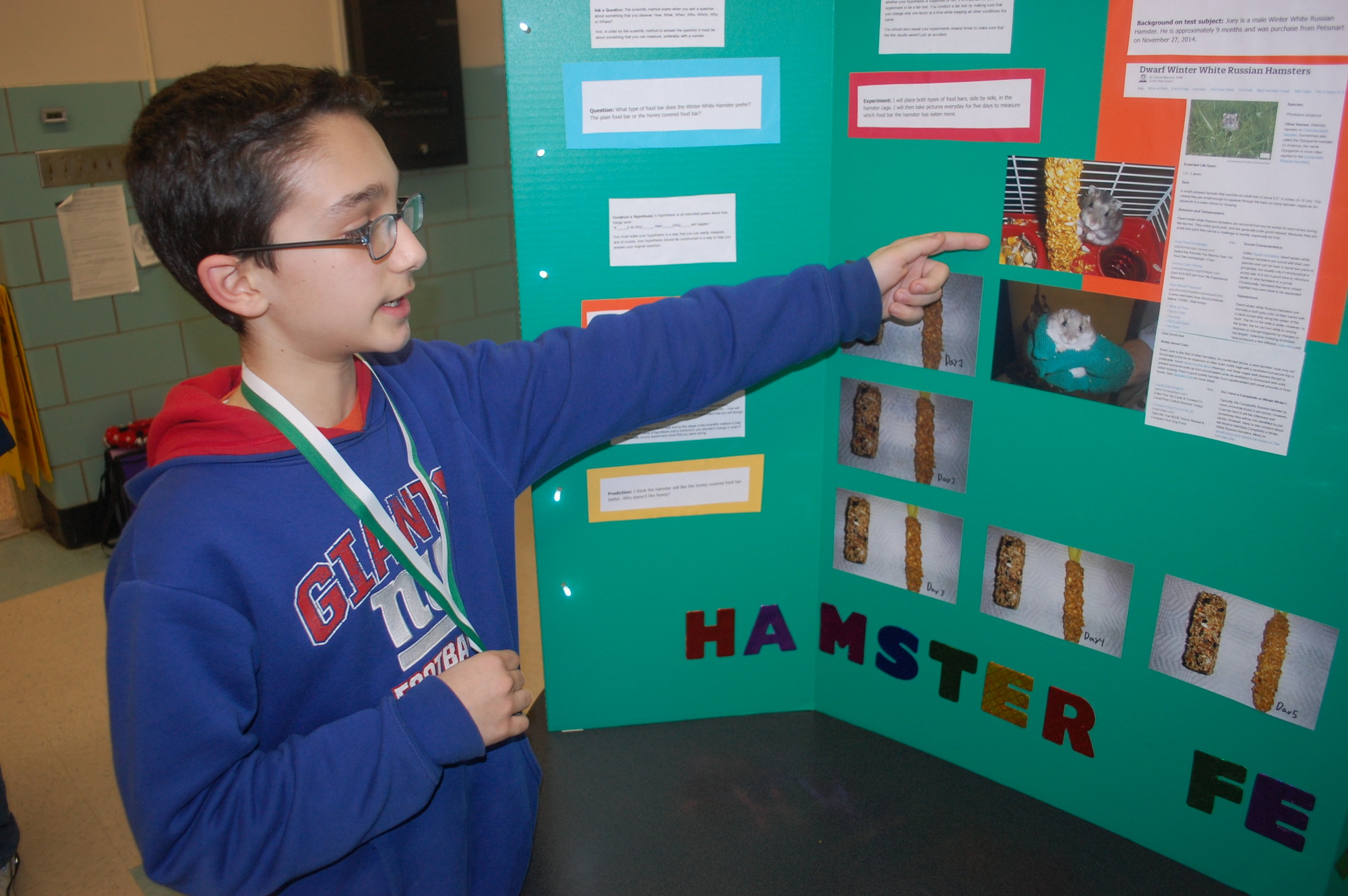 Sixth-grader Vincent Timiani showed the research he did in studying the food his hamster liked best.