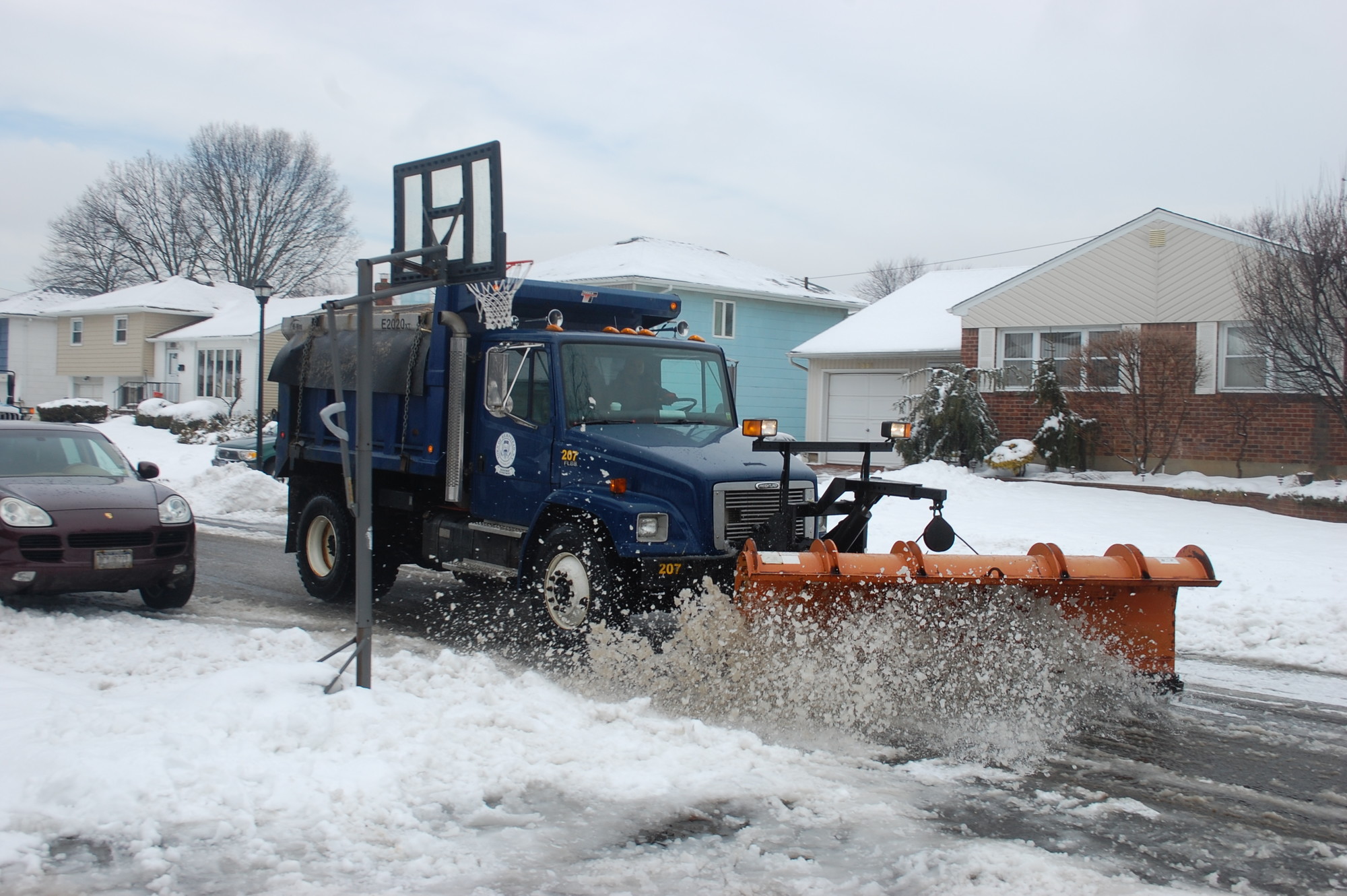 A Town of Hempstead plow clears Milanna Drive in Wantagh following a recent snowstorm.