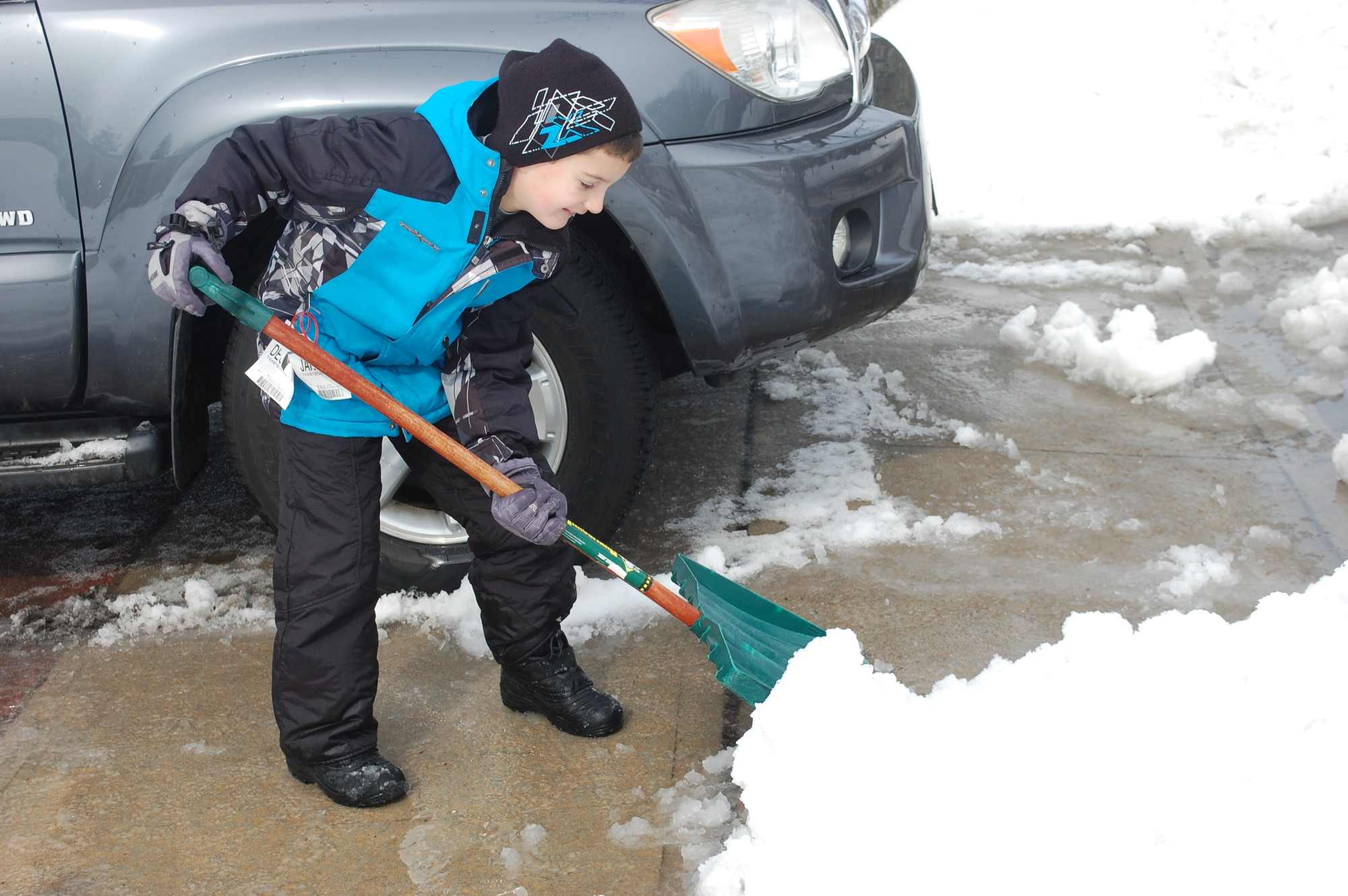 Vincent McCartney helped clear snow in front of his house on Feb 22.