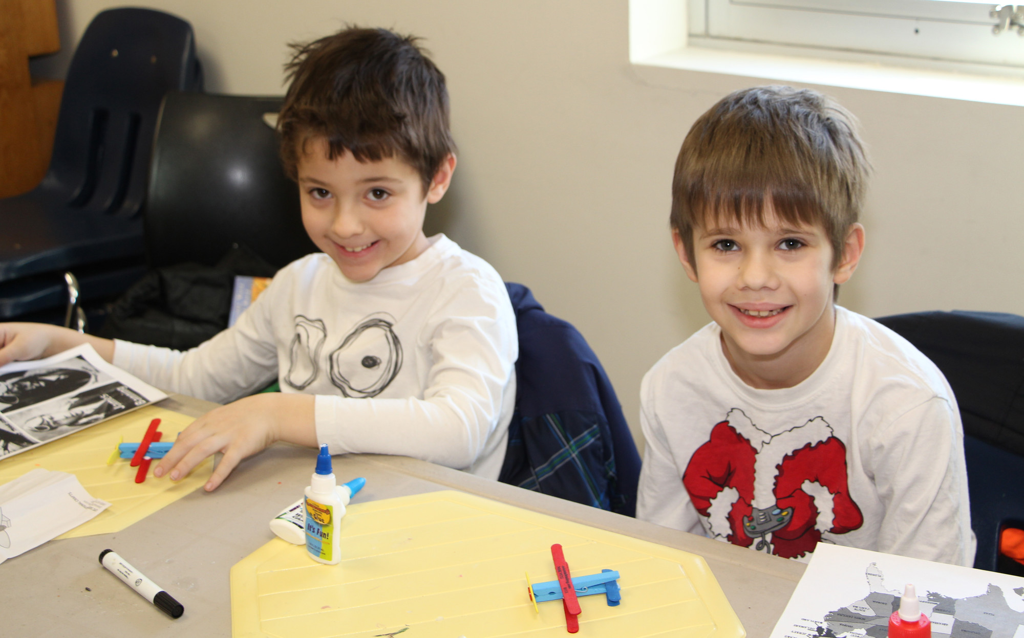 Brothers, Frederick Siena Horowitz, left, and Giovanni, 7, glued their planes together during the craft portion of the event.