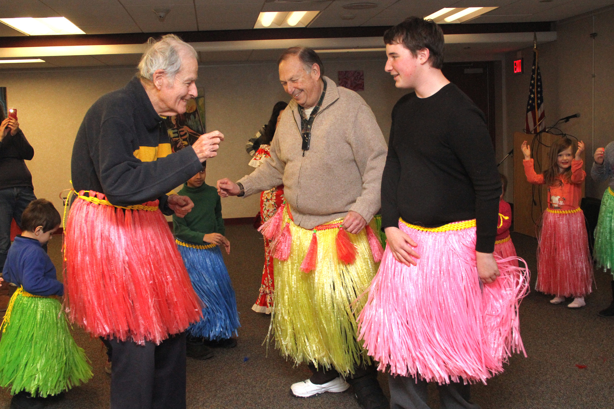 John Boles, left, John Boles, Fred Scheinfeld and Jack Klayman were brave enough to don hula skirts and dance.
