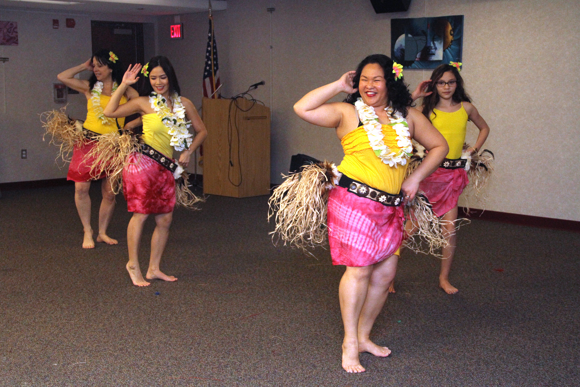 Mahana, left, and Nani Loa from Dance Aloha showed how to perform traditional Hawaiian dances.