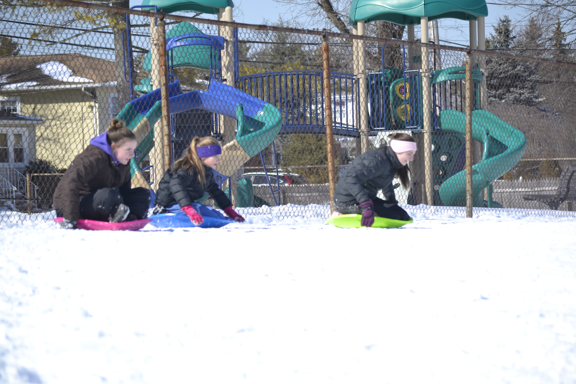 One silver lining of the cold? Sledding at Parkway Elementary School, where 12-year-olds Erin Rauchdauer and Julia Auricchil, and Caitlyn Auricchil, 15, spent a snowy day last week.                Photo by Nicole Monteleone/Herald