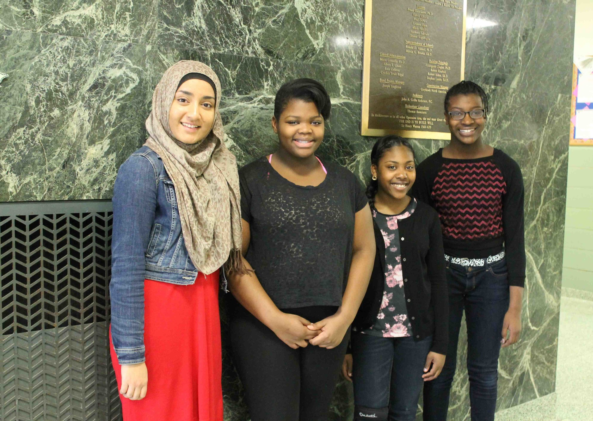 Eighth-graders Khadija Zahid and Alexandra Henrius and seventh-graders Ariana Smith and Jania Robinson won the school competitions for their grades.