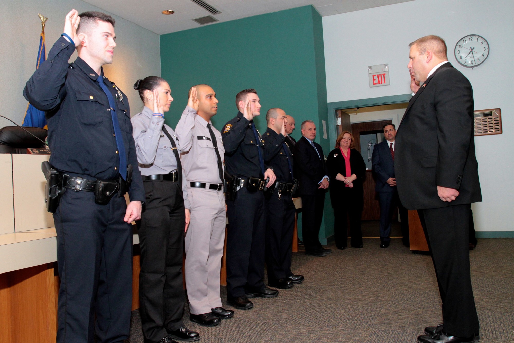 Police Commissioner Charles Gennario, right, swore in new officers, from left, Michael Farrell, Stefanie Balos, Jerremy Diaz, Nicholas Bamonte and Kyle Coppola as the village’s Board of Trustees looked on.