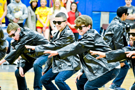 Freshmen Jason Giannattasio and Matthew MacKay, left to right at center, danced to the “Grease” theme song at East Meadow High School’s Battle of the Classes last Friday.      Photo by Nicole Monteleone/Herald