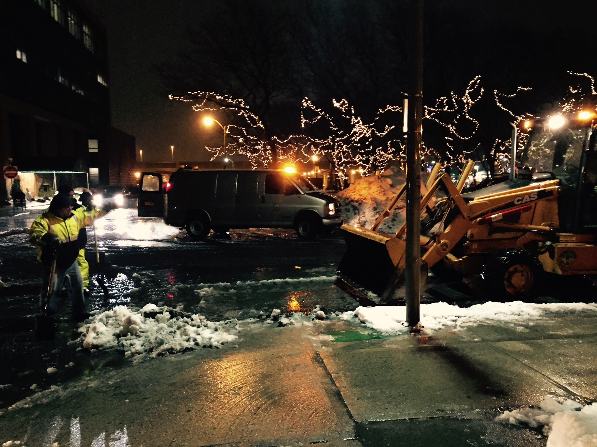 DPW crews cleared snow and storm drains on National Boulevard Tuesday night.