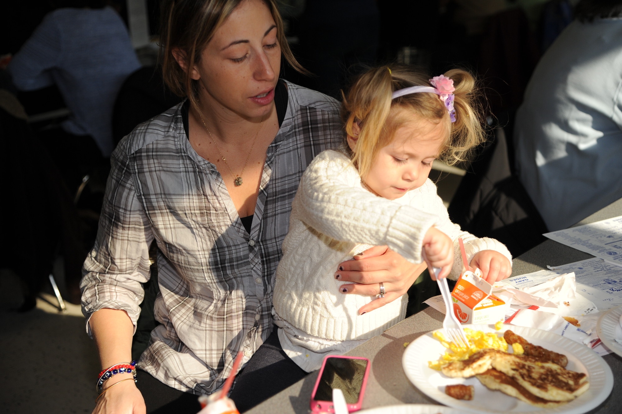 Jen Colucci, with young Nicolina, 2, chowed down.