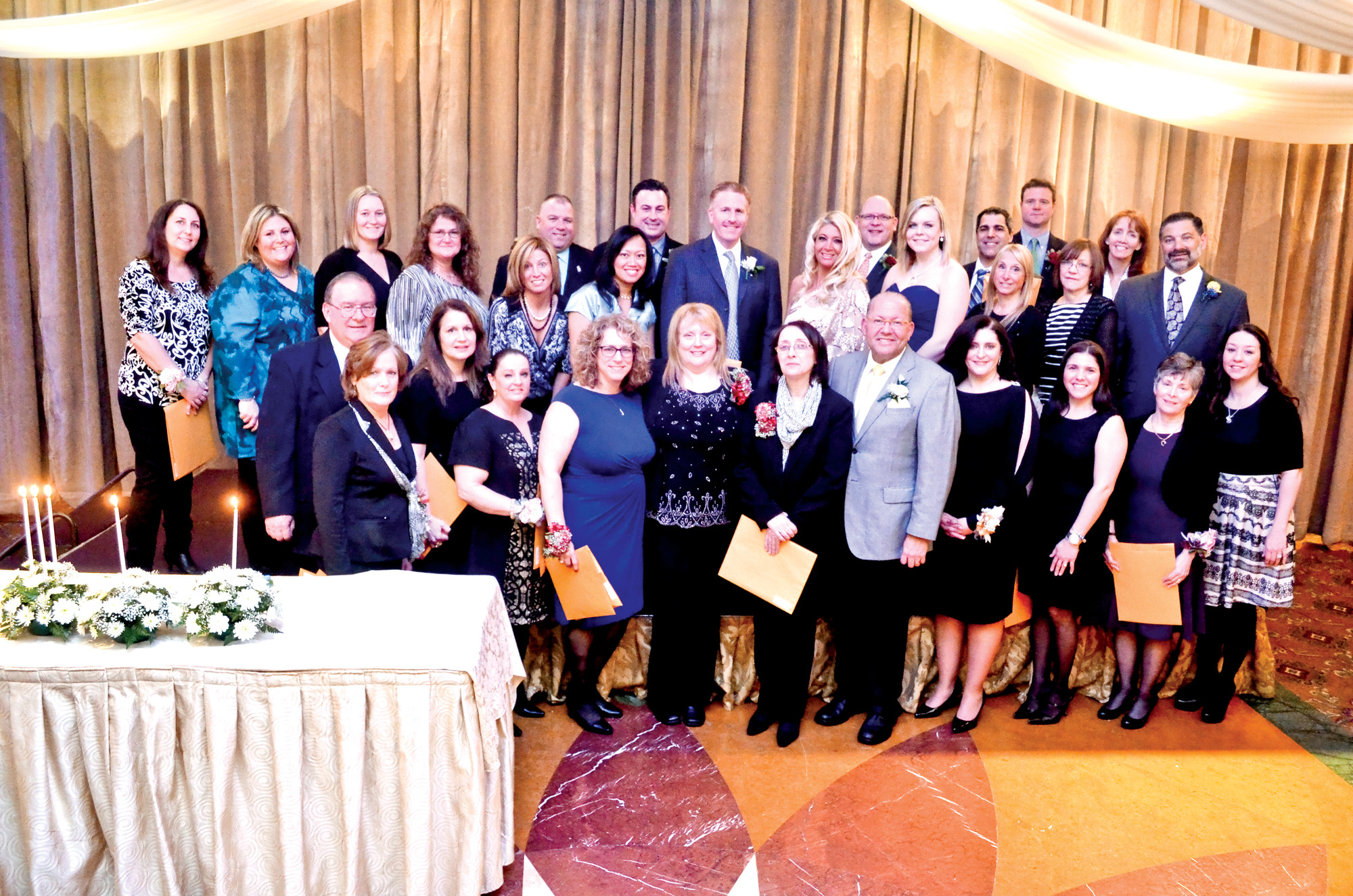 The East Meadow PTA Council will honor members from all nine school PTAs — plus SEPTA — at Monday’s Founder’s Day Scholarship Dinner. Above are honorees at the PTA Council’s 2014 ceremony.