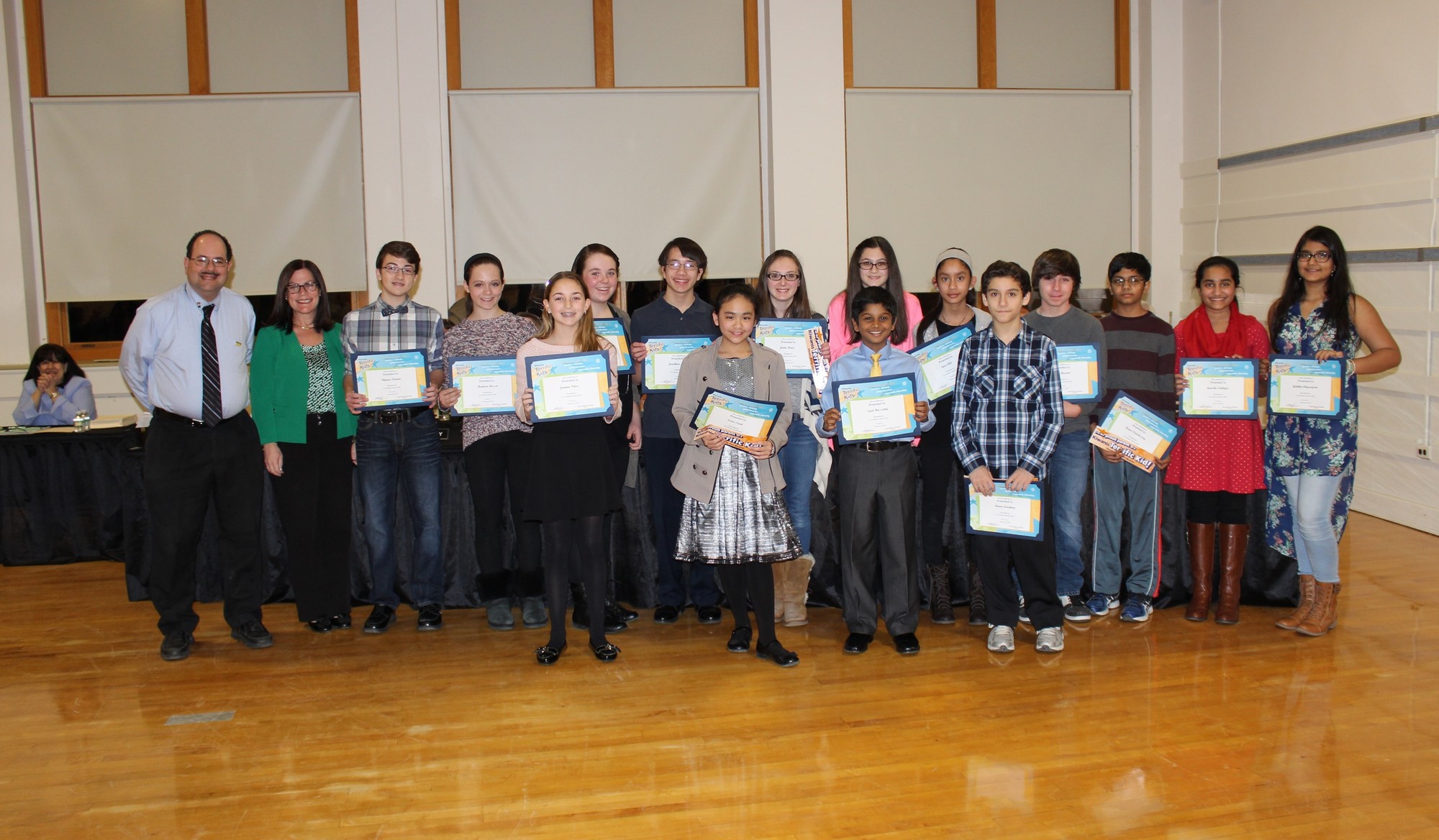 W.T. Clarke Middle School Principal Stacy Breslin and East Meadow Kiwanis President Kevin Kamper, far left, honored W.T. Clarke Middle School students with Terrific Kids awards.