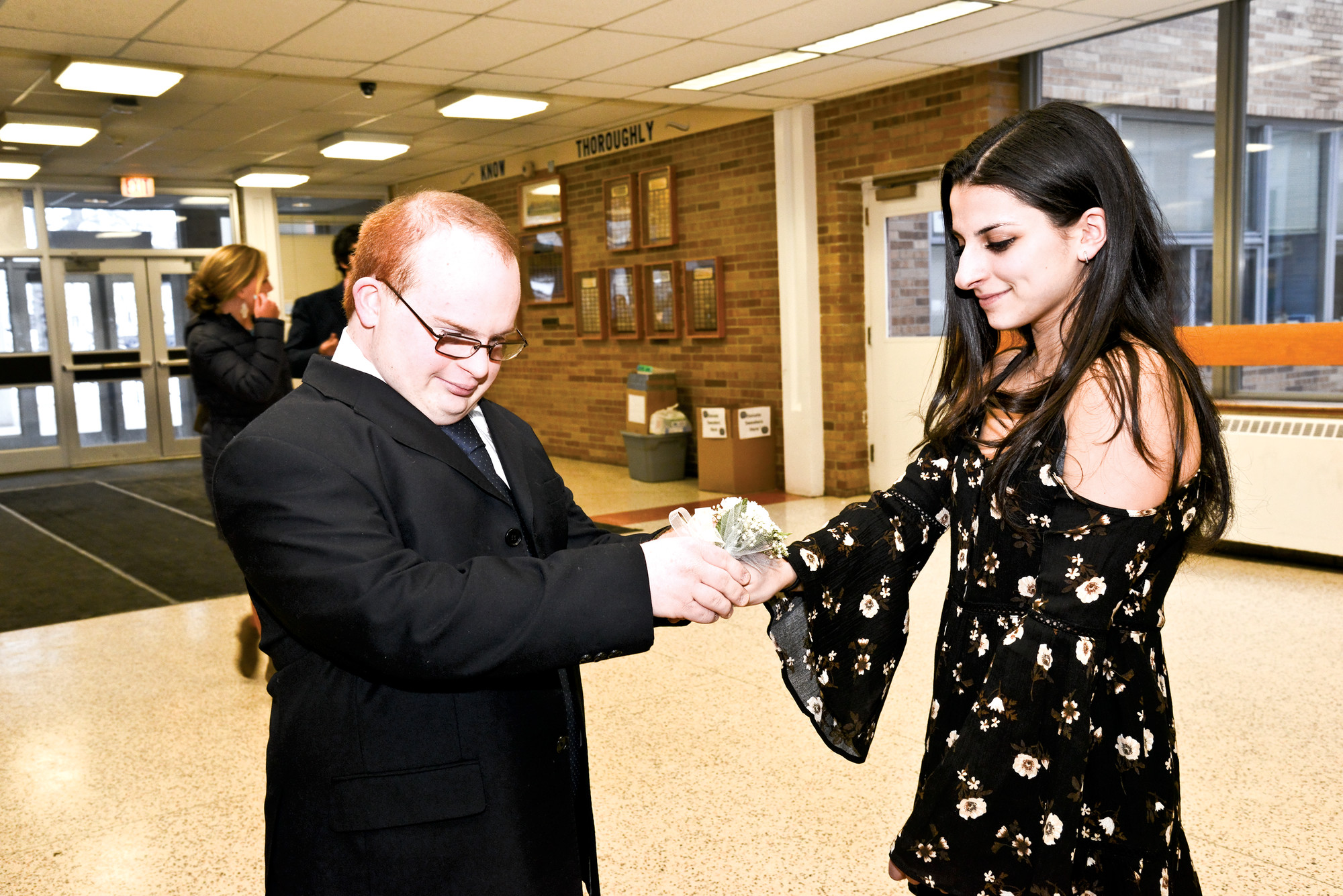 Kevin Costello greeted his date Kayla Cavlae with a corsage.