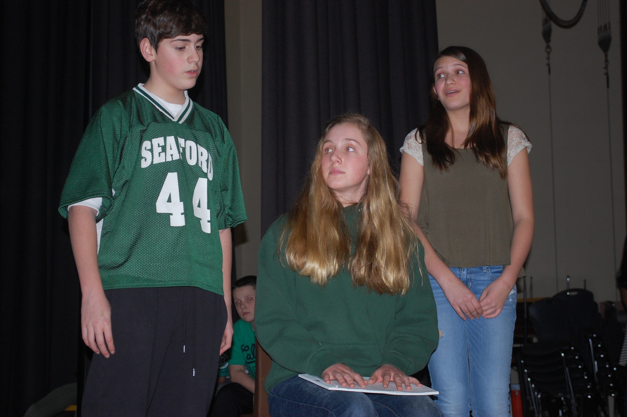 Lead actors Max Newman, as Troy, and Katie Crawford, right, as Gabriella, practice a scene with Lauren King.