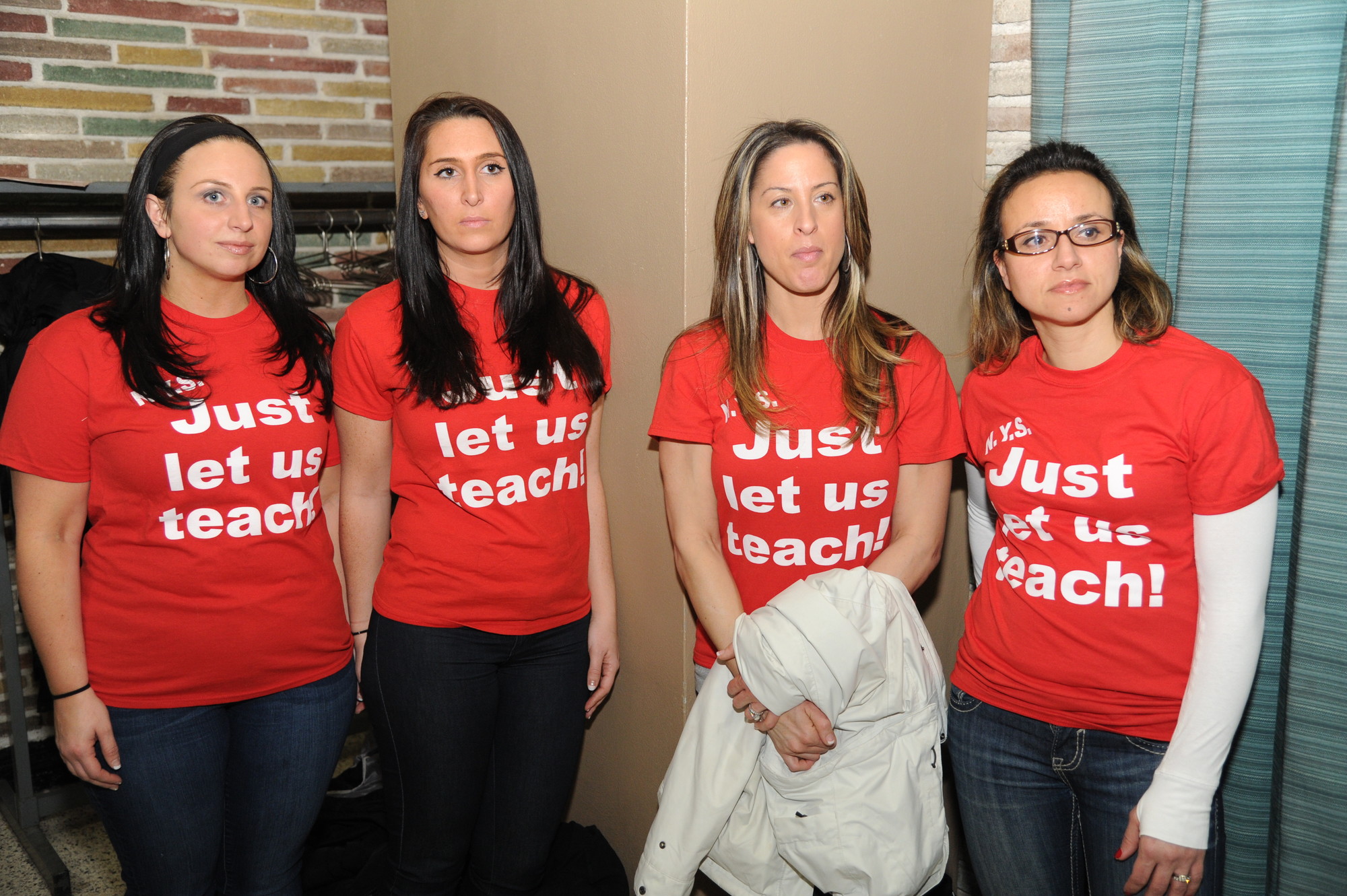 Area teachers, from left, Melissa Cangelosi, Lauren Funaro, Dani Iadevaia Andria Karousis showed their feelings about the Common Core tests at an education forum at Levittown Hall in Hicksville on March 16.