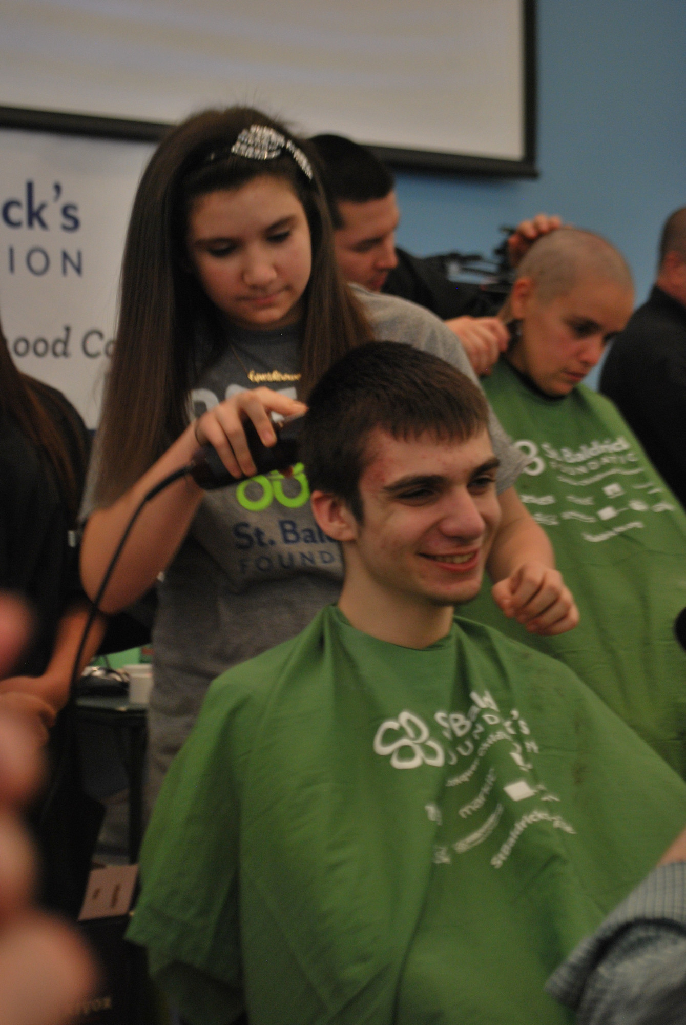 Molly Guarton, a cancer survivor, shaved the head of her brother, Billy.