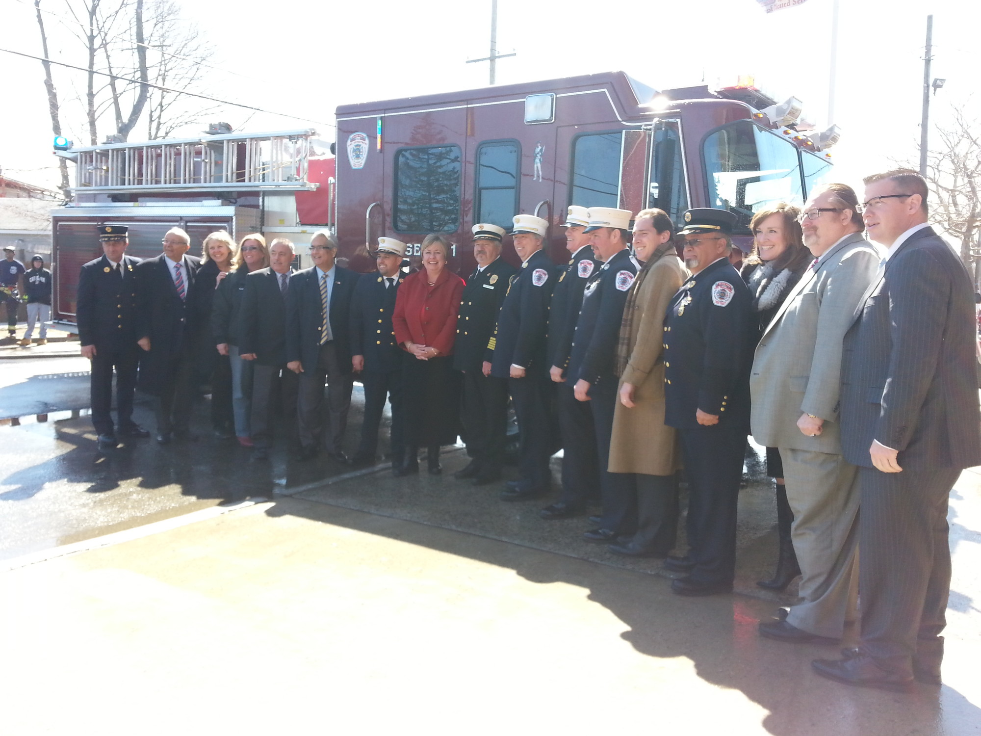 Chief Anthony D’Esposito (seventh from left) and members of the Island Park Fire Department were joined by U.S. Rep. Kathleen Rice, former Sen. Alfonse D’Amato, State Assemblyman Todd Kaminsky, County Legislator Denise Ford, Town of Hempstead Supervisor Kate Murray and Councilman Anthony Santino, Island Park Mayor Michael McGinty, Deputy Mayor Steve D’Esposito, and Trustees Irene Naudus and Matthew Paccione in welcoming new fire engine 225 to Island Park.
