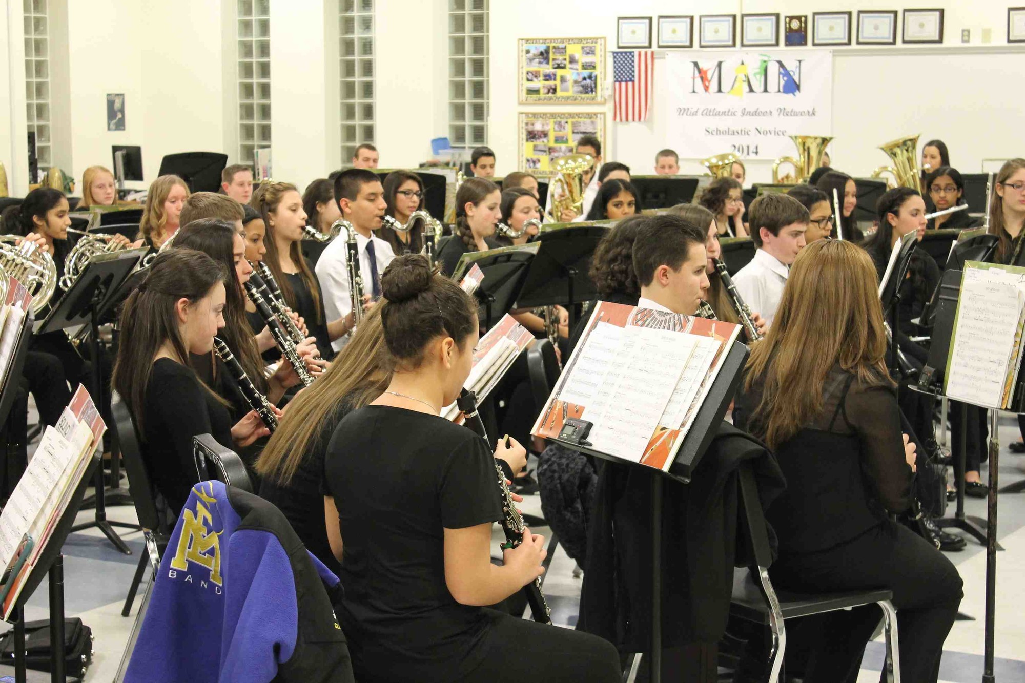 The East Meadow music program was named among the Best Communities for Music Education for the eighth time. At right, East Meadow High School ninth graders prepared for a winter concert last December.