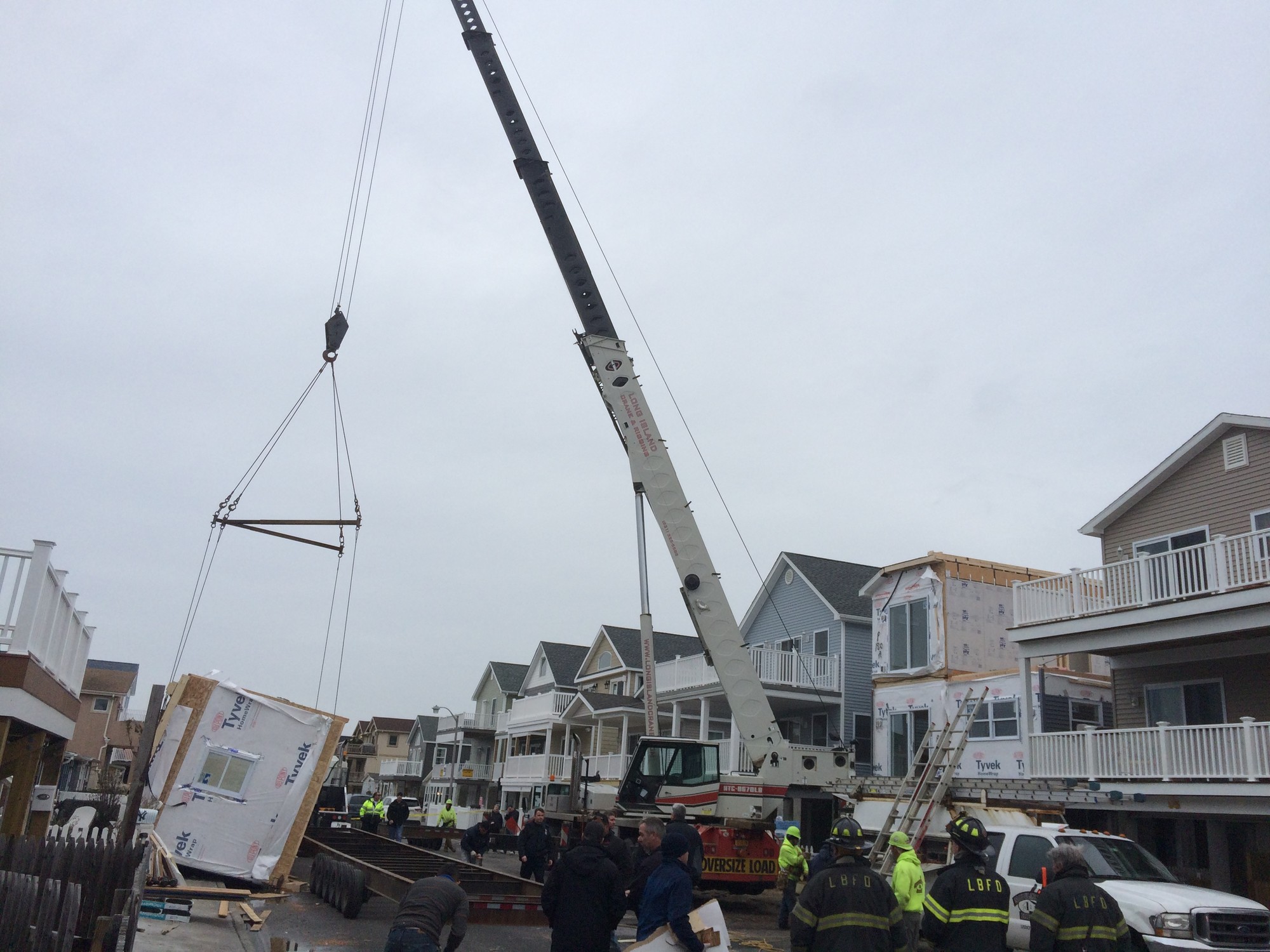 Police and firefighters responded to Pennsylvania Avenue on Friday after a crane lifting a section of a modular home broke loose.