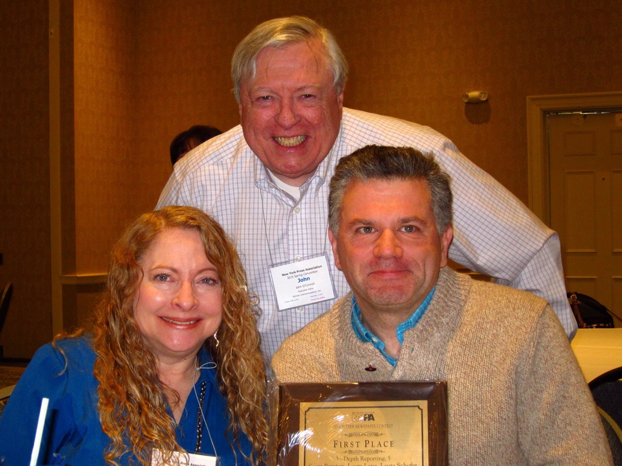 Executive Editor John O'Connell was joined by award-winners Laura Lane and Scott Brinton.