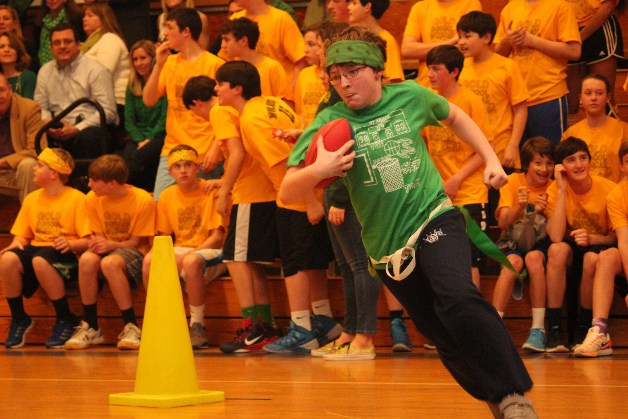 Green Team member Shane Kennedy quickly rounded the corner in the Tom and Jerry relay.