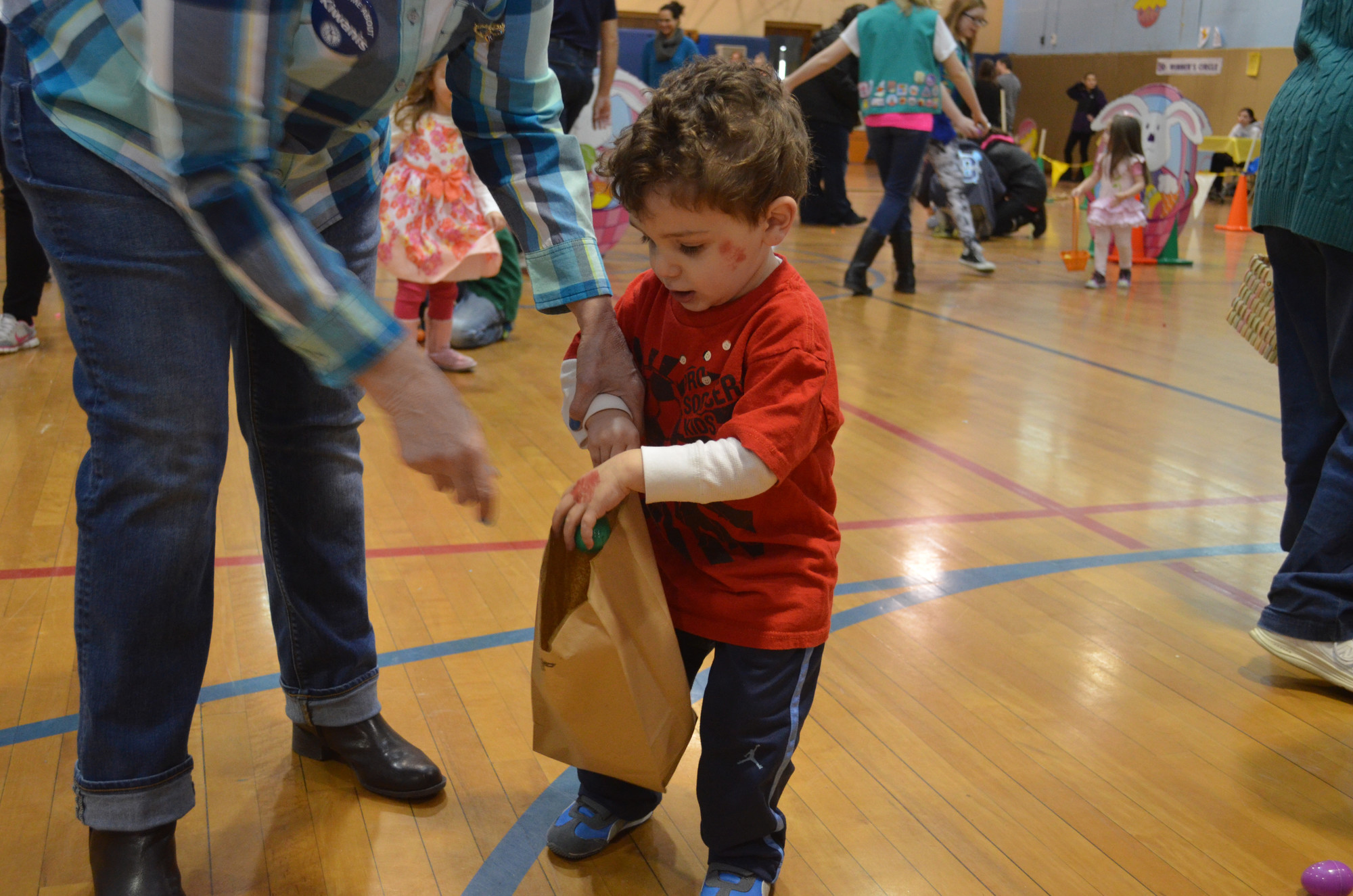 Marco Stornello, 2 and a half, picked up some Easter eggs.